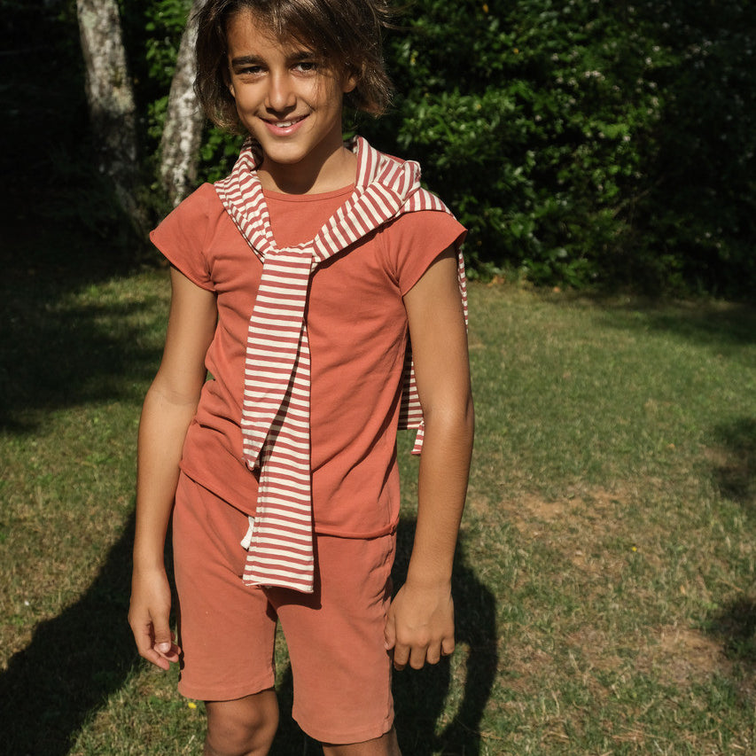 Little Hedonist super comfy organic surfer shorts in Apricot Brandy made from our softest organic cotton. Sustainable kids clothing for boys and girls.