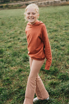 Little Hedonist super soft and cozy organic hooded sweater with raw edge sleeves for easy roll-up and multi-year use!
