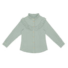 Little Hedonist slim fit blue shirt with ruffles in front and back. Super girly and though at the same time!