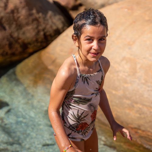 Child wearing organic swimsuit
