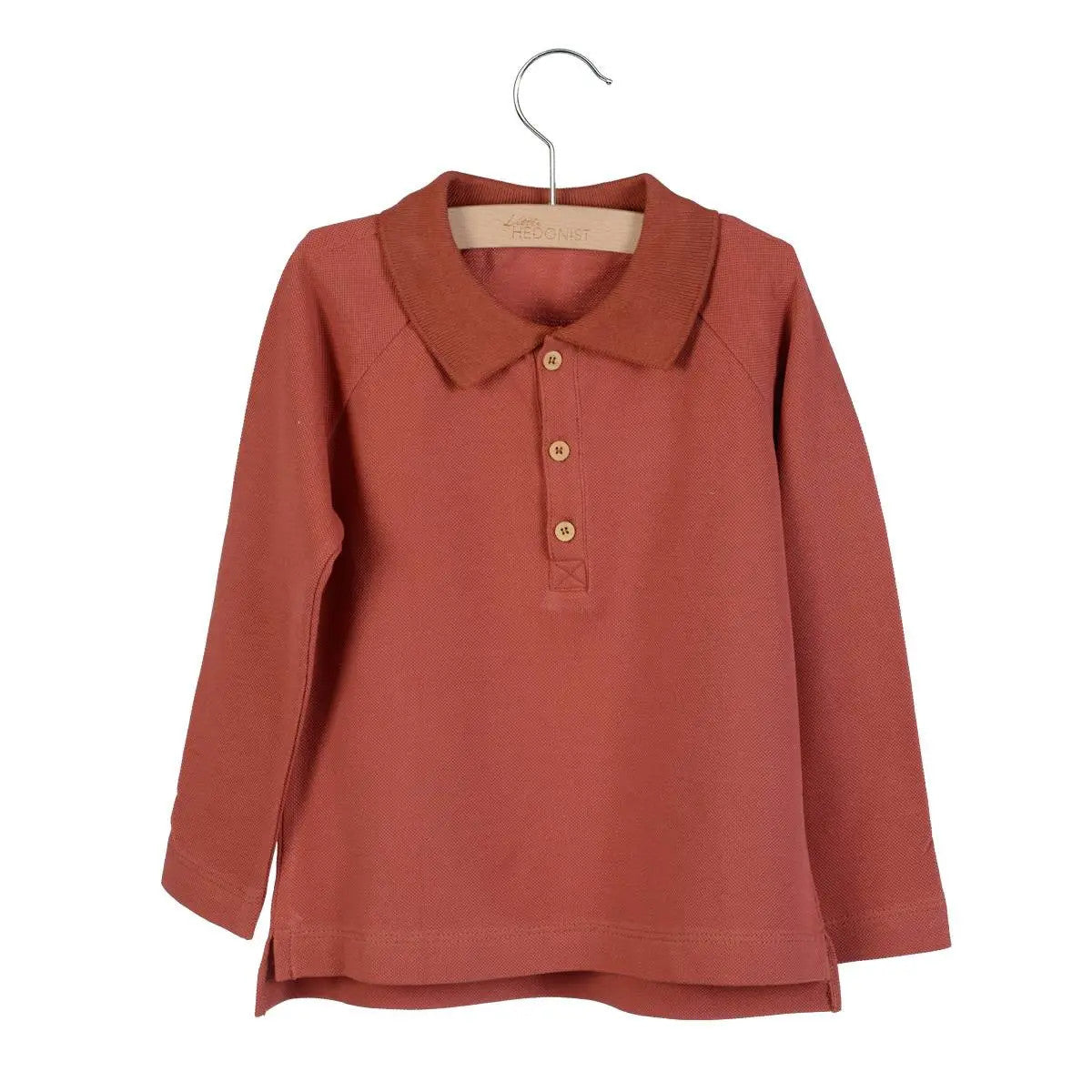 Little Hedonist organic rust longsleeve polo shirt with collar and buttons on the front.