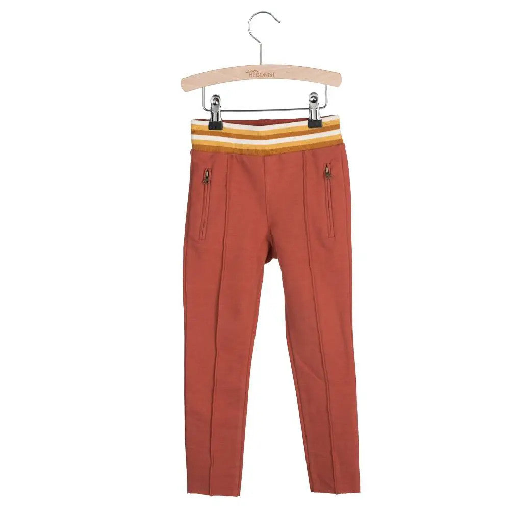 Little Hedonist organic track pants with a skinny cut in Chili Oil